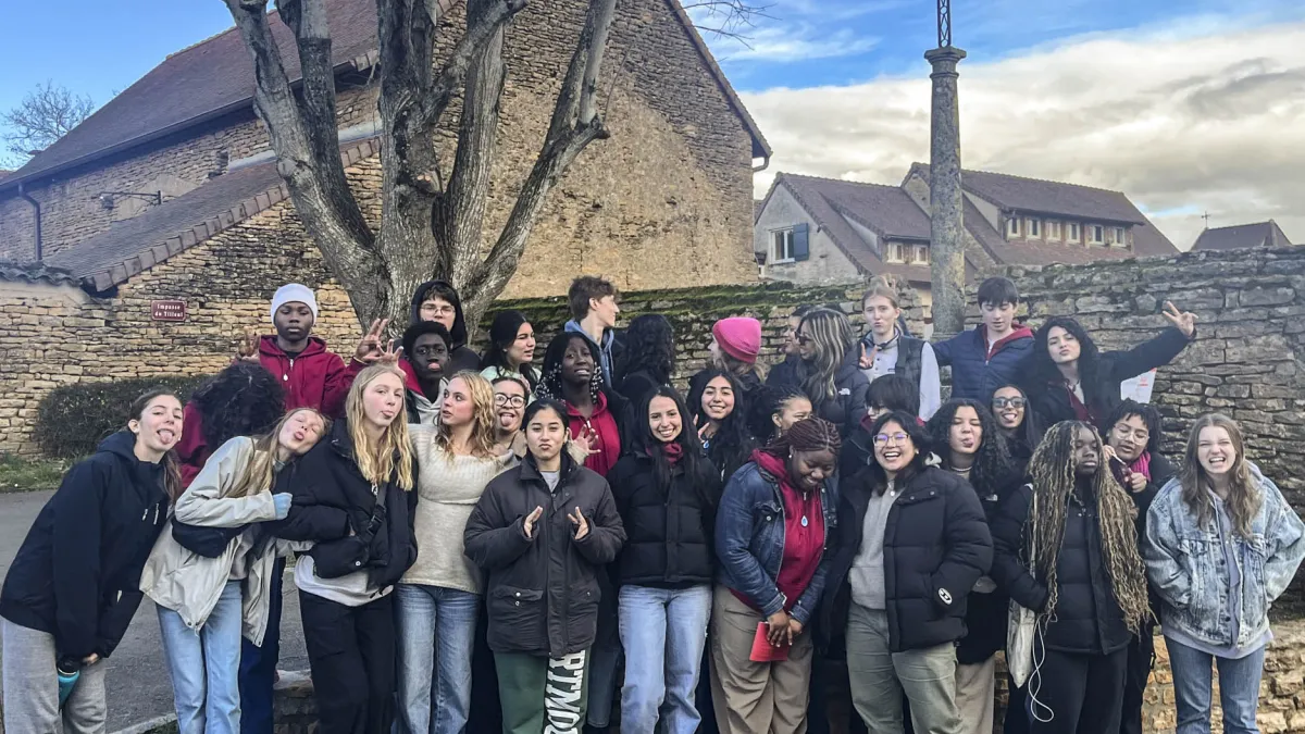 Youth Pilgrims pose for a group photo in front of Taize Monastery