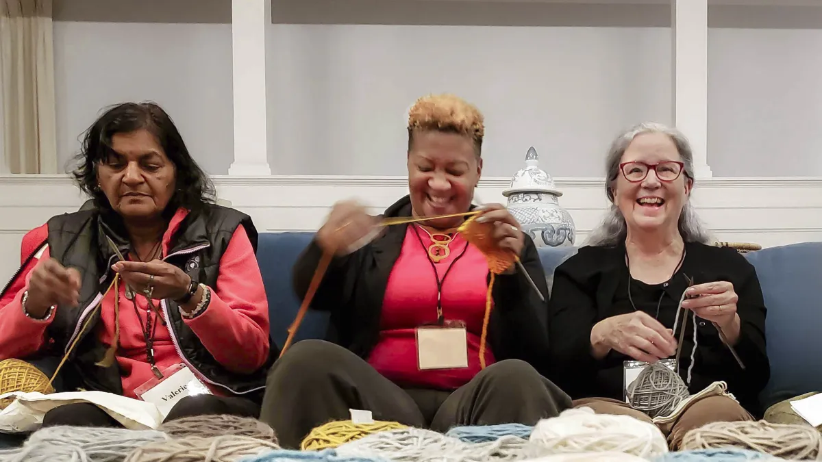 Friends knitting together