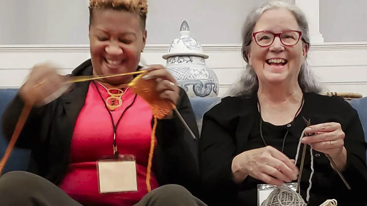 Friends knitting together