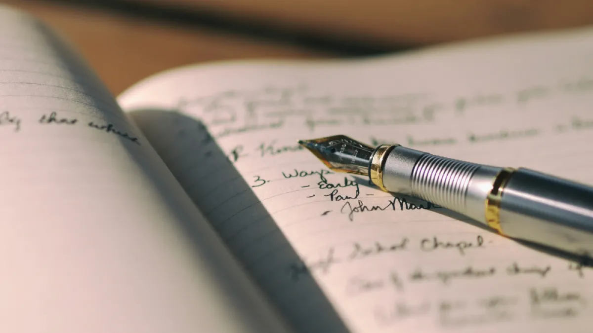 A pen on a notebook. 