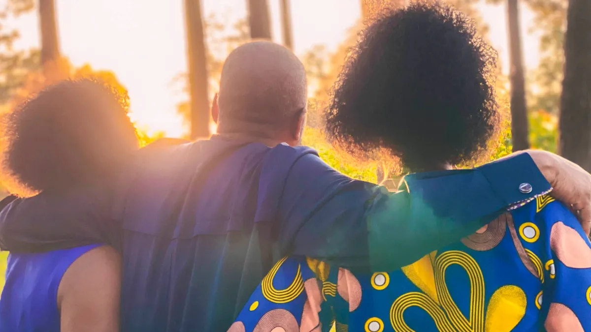 Three African American people face the sun