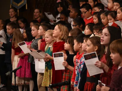 Youth choristers sing during a holiday concert.