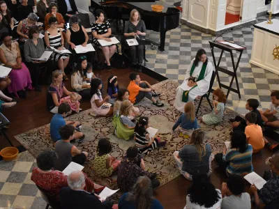 Mother Kristin sits teaching children in St. Paul's Chapel