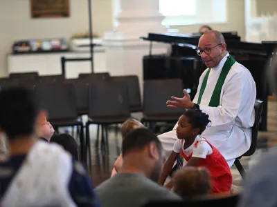 Fr. Phil Jackson gives a lesson during the 9:15am family service at St. Paul's Chapel