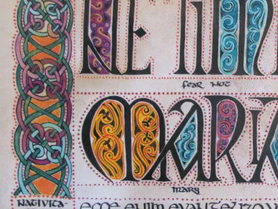 Image of an illuminated manuscript with ornate calligraphy with gold, blue and purple accents.