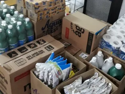 Boxes of bottled water and other necessities