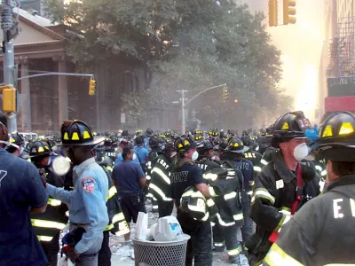 Firemen amassed on Broadway, with St. Paul's Chapel in the background, on September 11, 2001