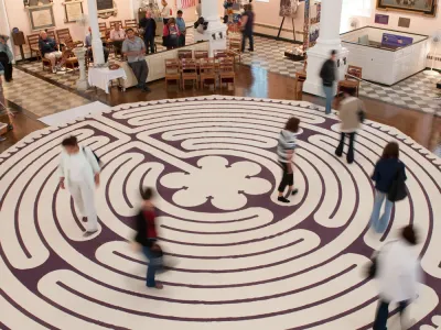 People walk on the labyrinth inside St. Paul's Chapel, September 11, 2009