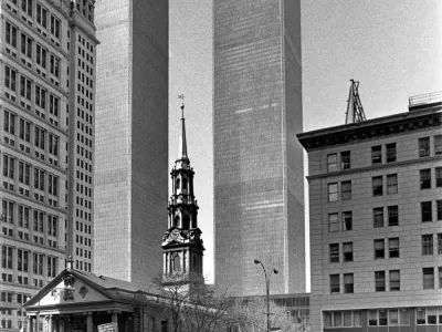 Black and White photo of St. Paul's Chapel with the World Trade Center towers