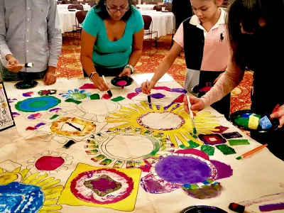 Adults and children creating art