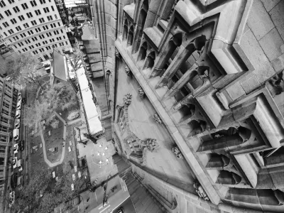 Black and white image of Trinity Church steeple looking down on churchyard