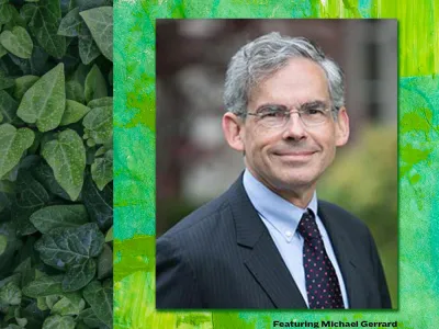 Headshot of Michael Gerrard in a suit on a green background