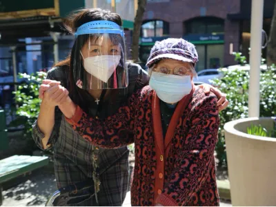 Yuetying Lee (right) and Sing Lam in the garden at St. Margaret’s House. 