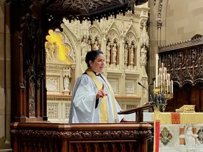 Mother Beth preaching from the pulpit.