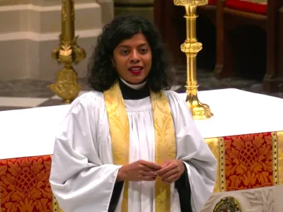 Mother Winnie preaching at the altar