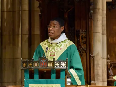 Father Loua in the pulpit