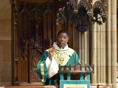 Father Loua in the pulpit