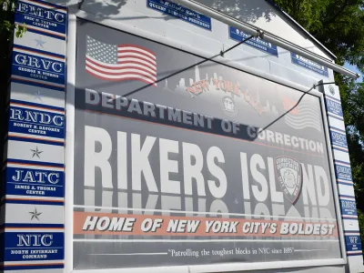A sign which reads "Department of Correction, Rikers Island. Home of New York City's Boldest"