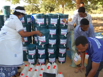 Mothers' Union leaders in Tanzania distribute hygiene materials such as handwashing stations and hand sanitizer to local communities as part of an emergency COVID-19 response. 