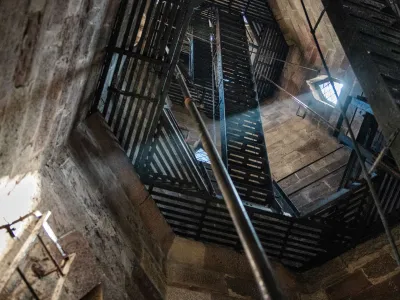 A beam of sunlight shines through a window in the bell tower of Trinity Church Wall Street