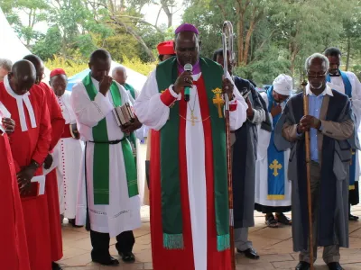 Members of the clergy in Nairobi Kenya offer prayers in outdoor church service