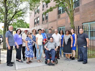 LISC NYC staff stand in front of one of the properties they support.