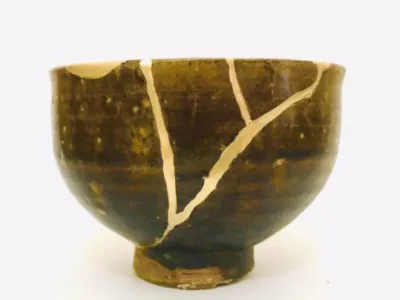 Broken ceramic bowl mended with gold