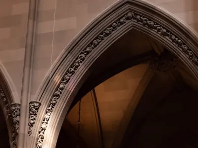 Light reflects off the vaulted ceiling of Trinity Church