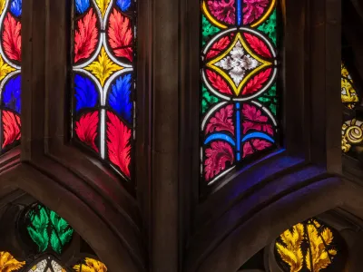 Bright red, yellow, blue, and green stained glass in Trinity Church