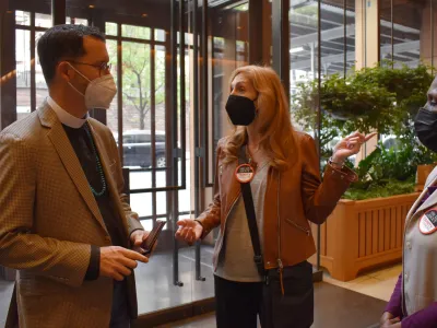 Trinity Ambassadors greeting a guest in Trinity Commons