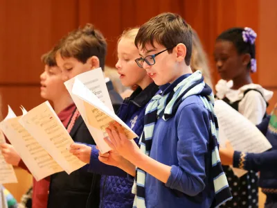 A children's choir sings during Family Service in the Parish Hall