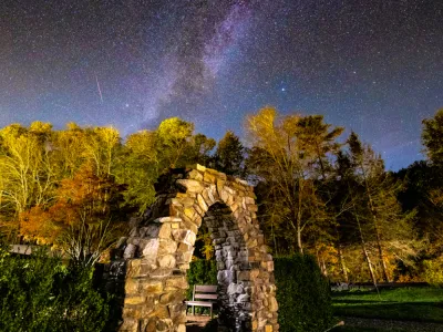 Stone arch with Milky Way galaxy