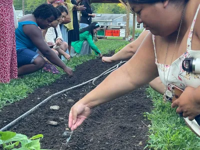 Retreatants sow seeds at the Trinity Retreat Center farm