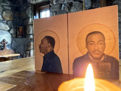 Icon of the Rev. Dr. Martin Luther King, Jr. with a candle