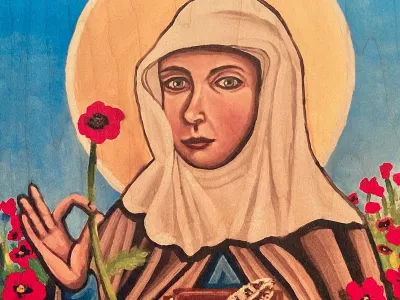 Illustration of Julian of Norwich, wearing a light brown robe with blue sleeves and a beige veil. She stands in front of a blue sky and a yellow disk, representing the sun. Julian is holding one red flower between her right thumb and pointer finger, in her other hand, a book and a feather.