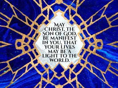 blue stained glass with blessing written in a burst of light