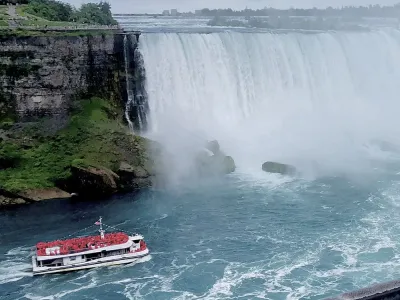 A sightseeing boat approaches Niagara Falls