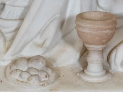 Marble relief of chalice and plate of bread
