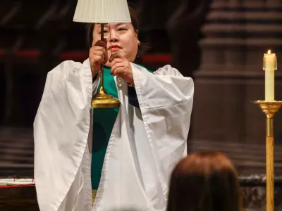 Mother Yein with a lamp