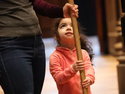 A child serves during worship at Trinity Church