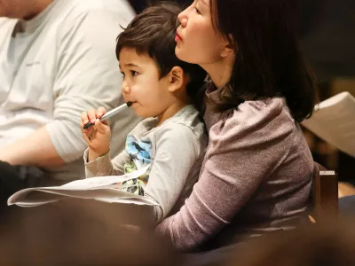 A child and adult together during 9am worship at Trinity Church