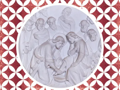 Marble carving of Jesus washing a disciple's feet