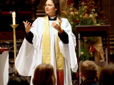 Mother Kristin in the sanctuary preaching to children