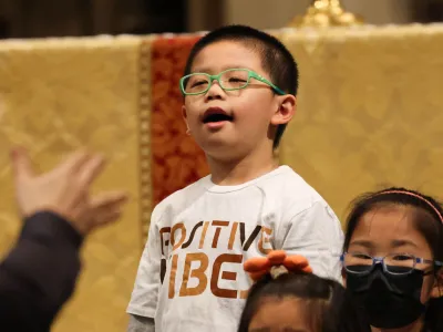 A child sings in Trinity Church during the 9am Holy Eucharist