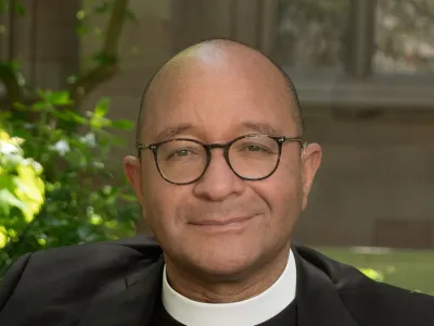 The Rev. Phil Jackson, Rector, headshot in Trinity Churchyard