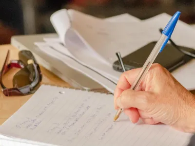 Someone is writing in the notebook