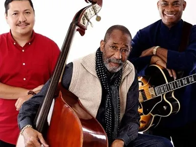 Ron Carter Trio of three men with their instruments: a bass and guitar