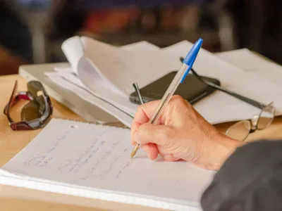 Person writing in a notebook