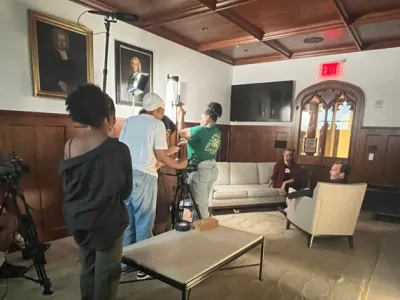Students adjust cameras in Vestry room to prepare for an interview