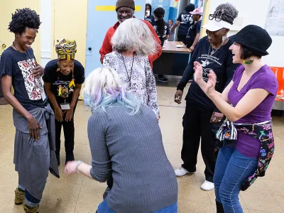 People dance at a workshop led by dance company Urban Bush Women